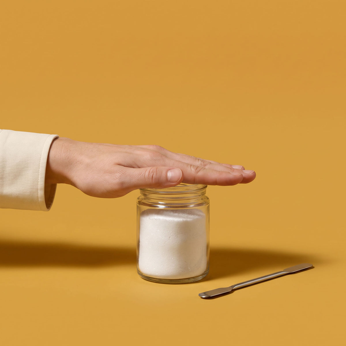 batch record 02 hero: bare hand closing an open jar of white powder